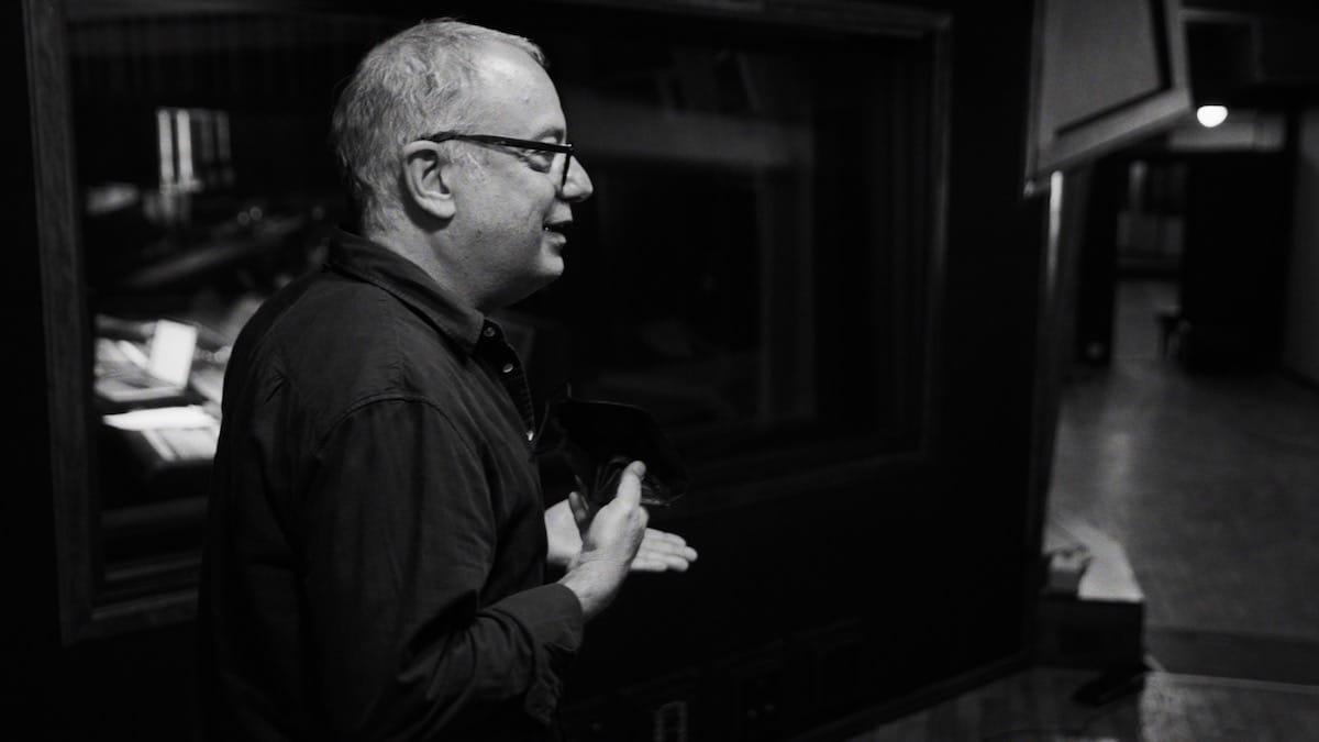Black and white photo of Larry Klein in a recording studio