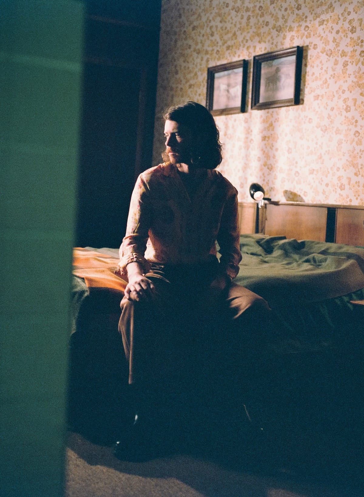 Old Sea Brigade's Ben Cramer sits on a bed