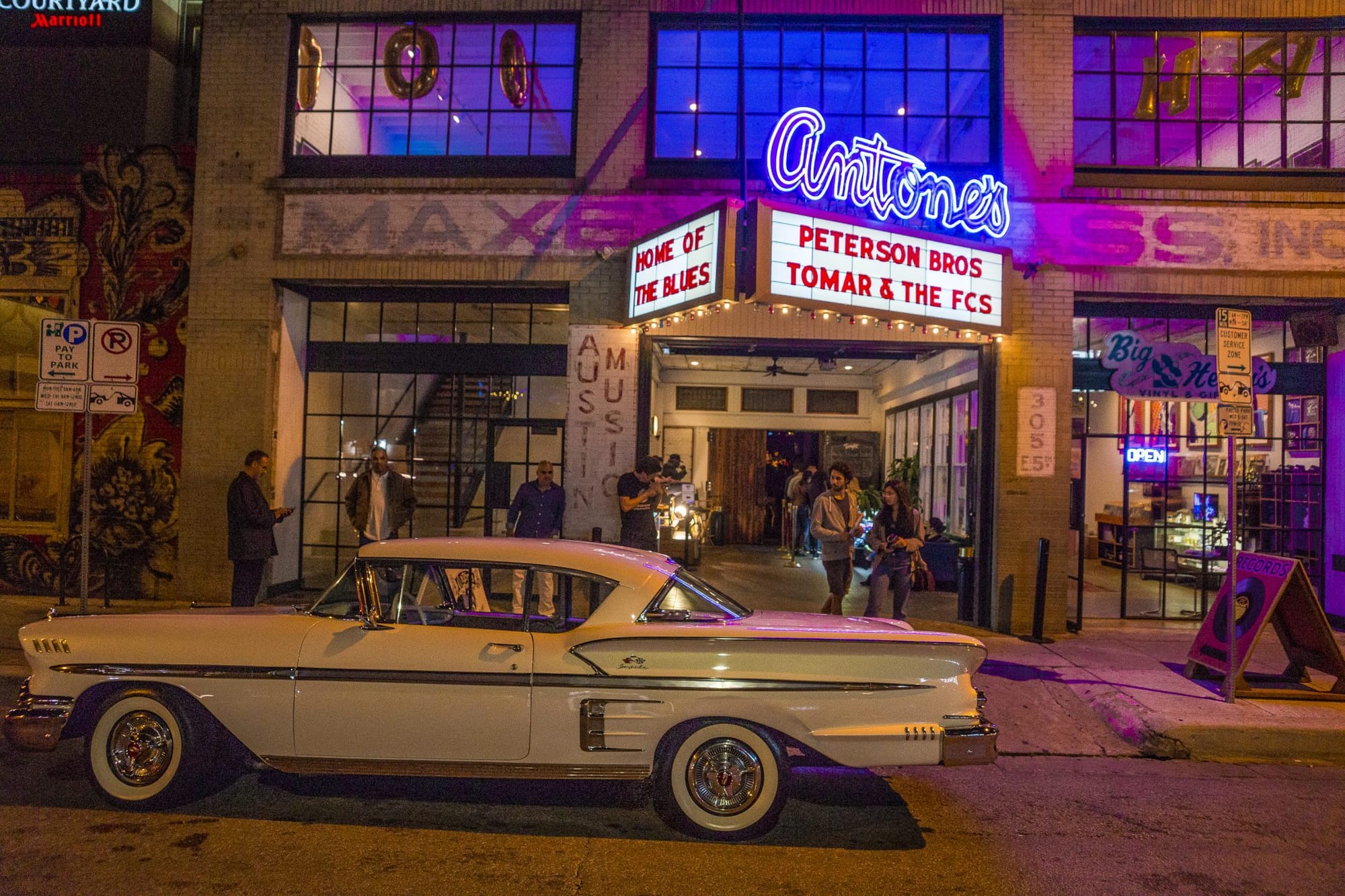 Image of the outside of Antone's in Austin, Texas, with a marquee reading, "Peterson Bros" and "Tomar & The FCs"
