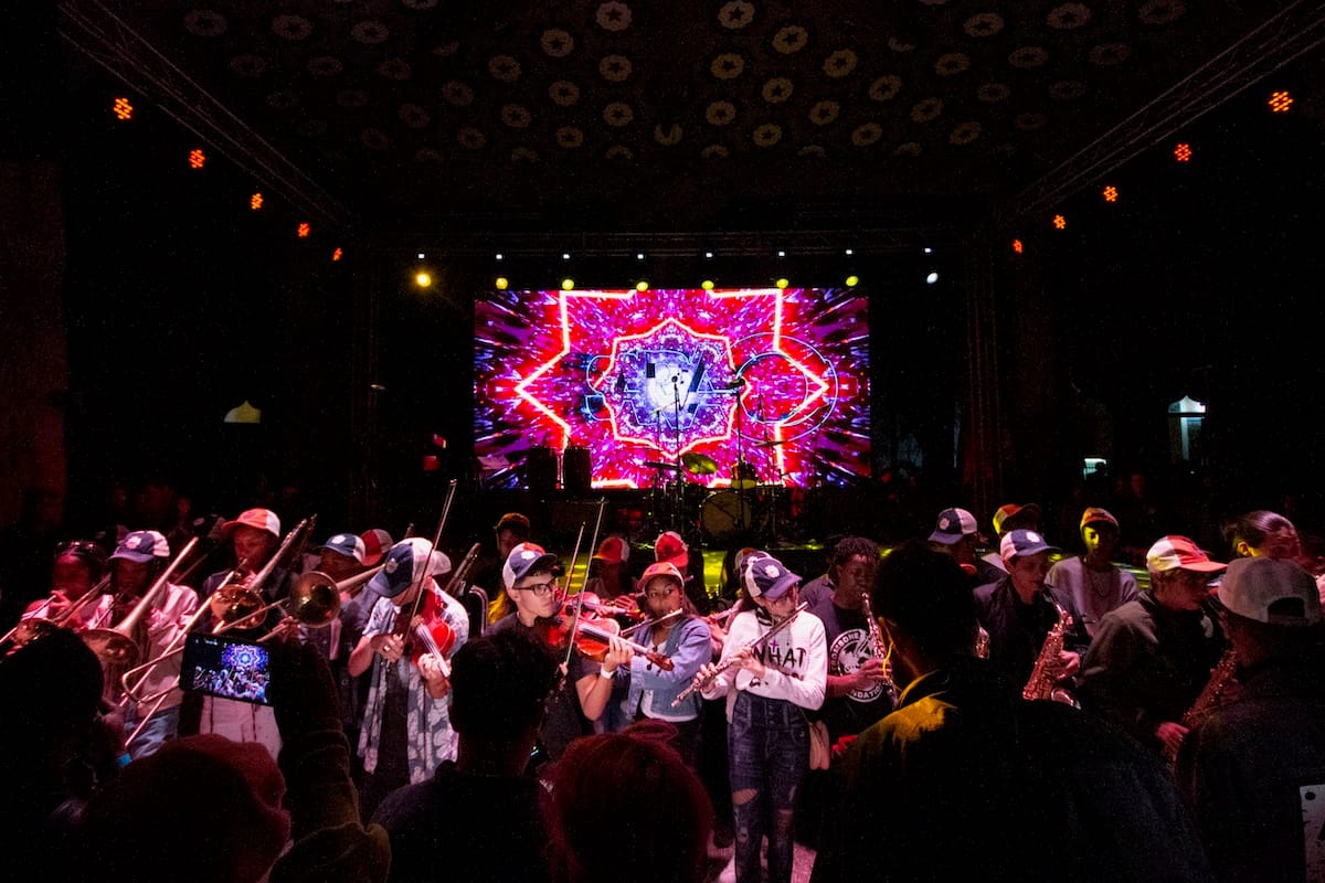 Students from the Guillermo Tomas Music Conservatory open for Trombone Shorty & Orleans Avenue from the floor right in front of the stage at Los Jardines de la Tropical.