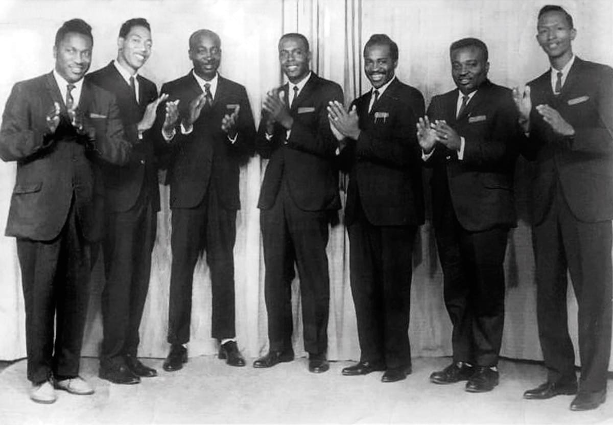 A black and white photo of the seven men of The Lynn Harmonizers