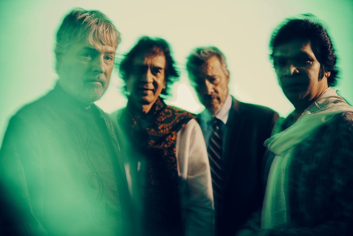 A blurry portrait of four men